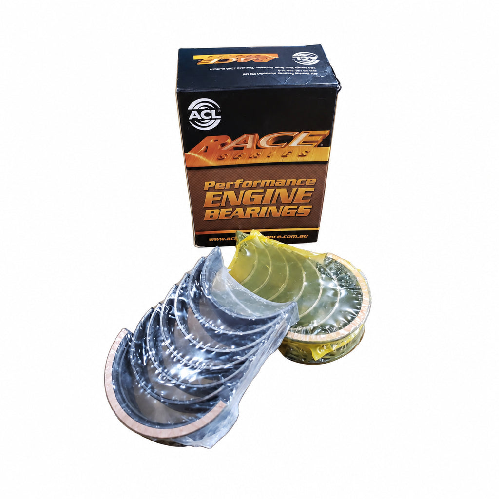 A set of ACL Race Series main bearings for BMW M20, S50, and S52 engines, displayed in front of its packaging box.