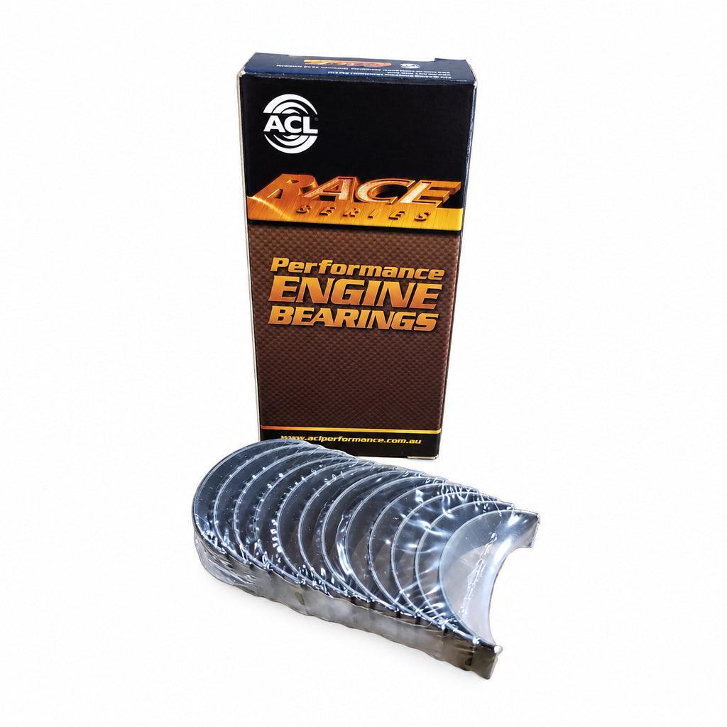 A set of ACL Race Series connecting rod bearings for BMW M20, S50, and S52 engines displayed in front of its packaging which reads 'Performance Engine Bearings'.