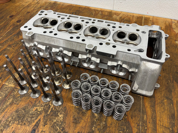 BimmerHeads BMW S14 M3 cylinder head shown with valves and Supertech valve springs.