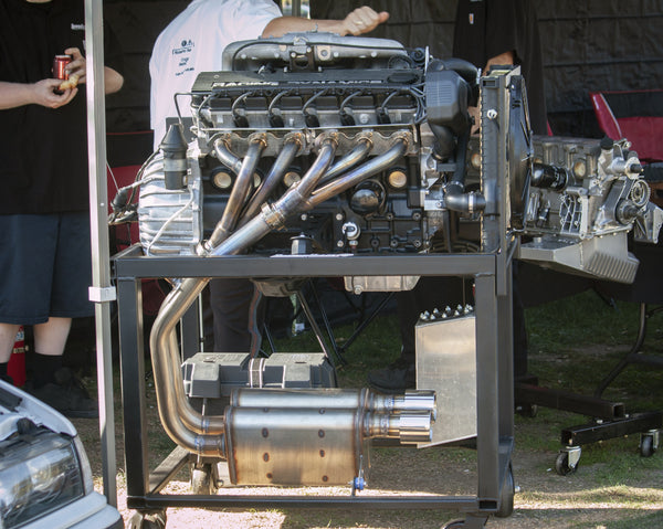 BimmerHeads 2.9L roller camshaft stroker engine shown on custom engine run stand.