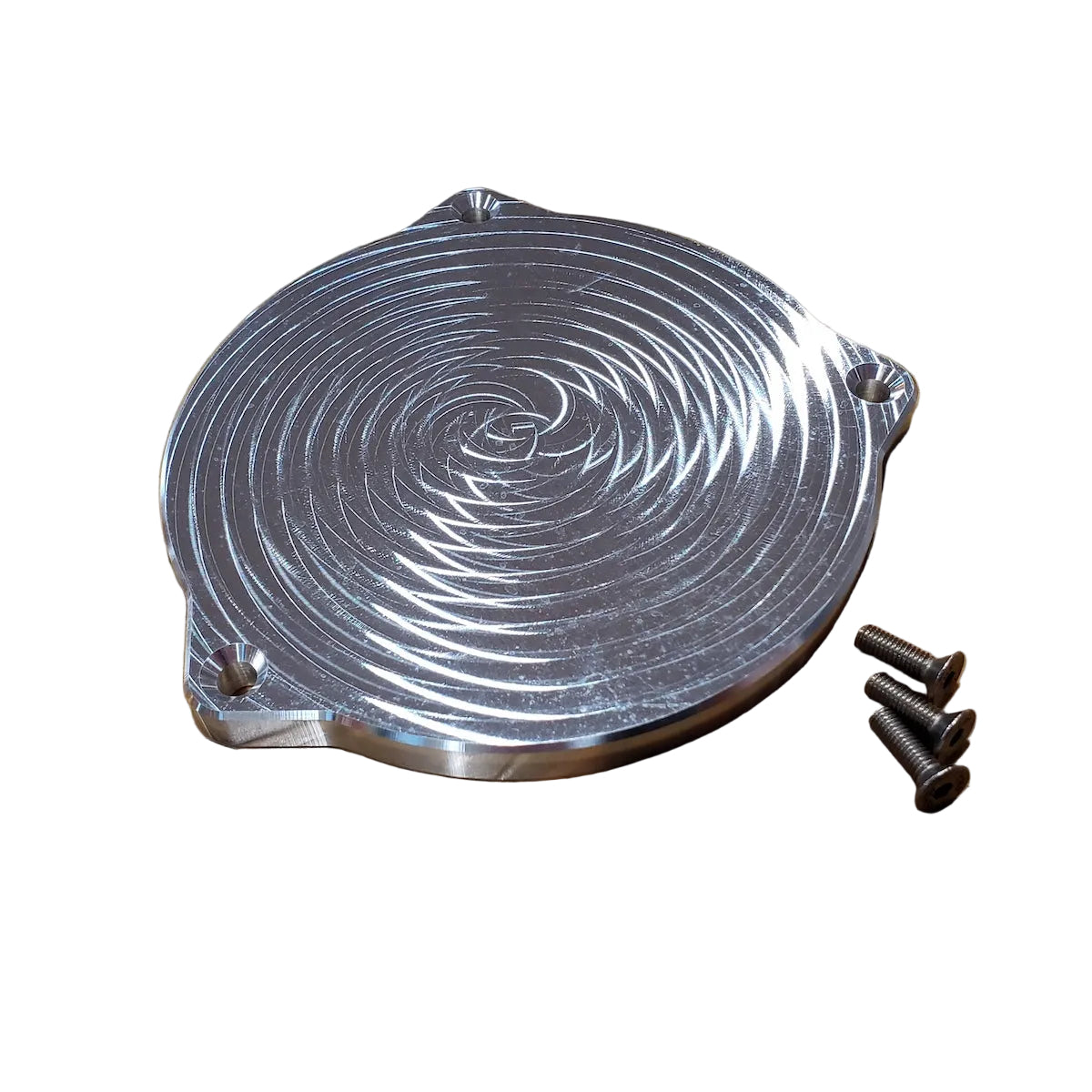 A silver-colored metal distributor delete plate for BMW M20 and M30 engines, accompanied by mounting hardware.