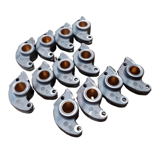 Set of 12 cast aluminum rocker arms made by Febi for BMW M20 engines.