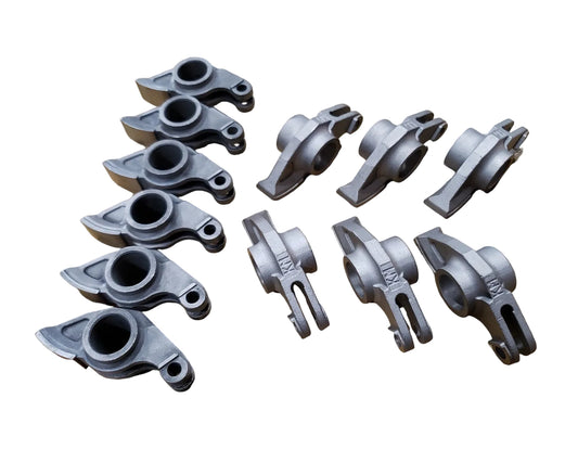 A set of 12 forged steel racing rocker arms for BMW M20 engine. Made by KM Cams.