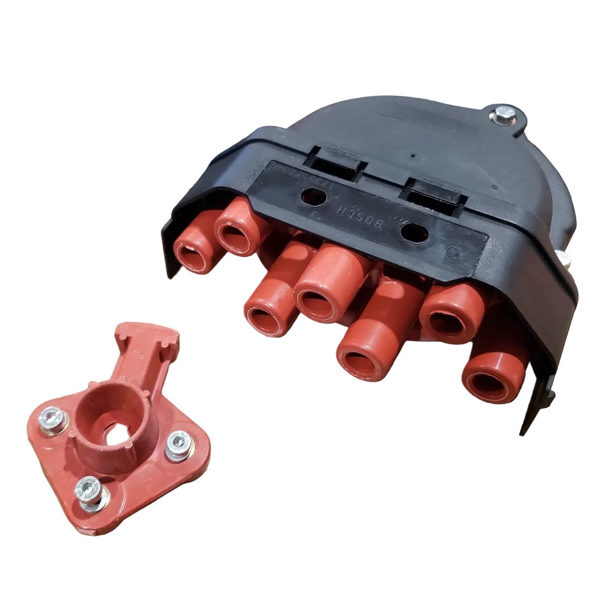 Bosch distributor cap and ignition rotor for BMW M20 and M30 engines.