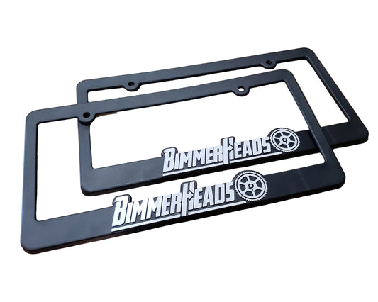 Two black plastic license plate frames with the BimmerHeads logo on them.