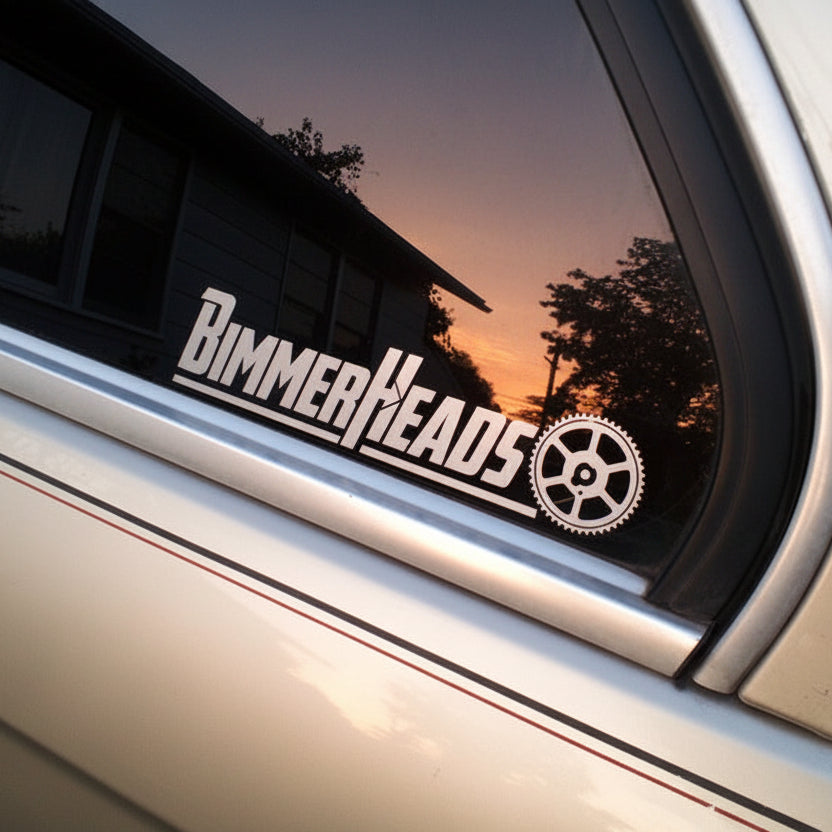 BimmerHeads Decal Sticker shown on E30 rear side window in silver.