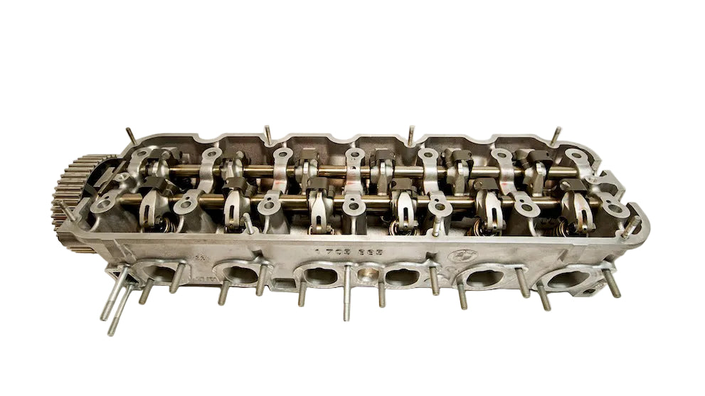 A BimmerHeads BMW M20 Super Sport 885 cylinder head, with valves and valve train components.