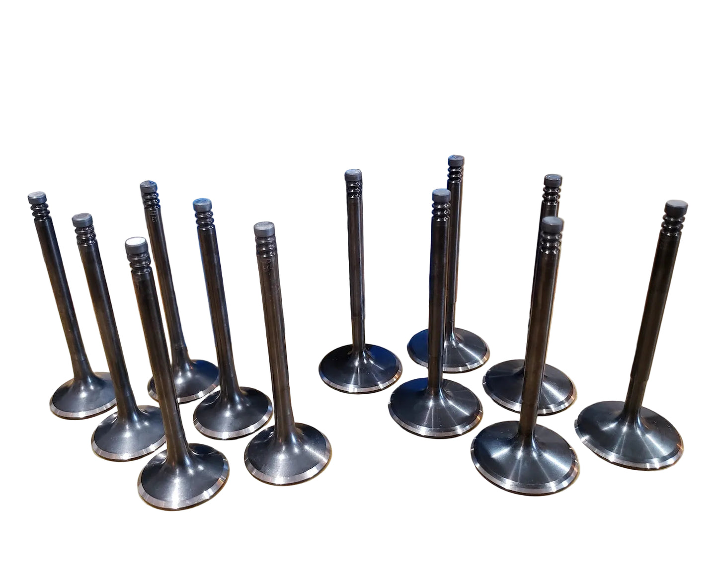 A set of stainless steel Supertech valves for a BMW M20 engine.